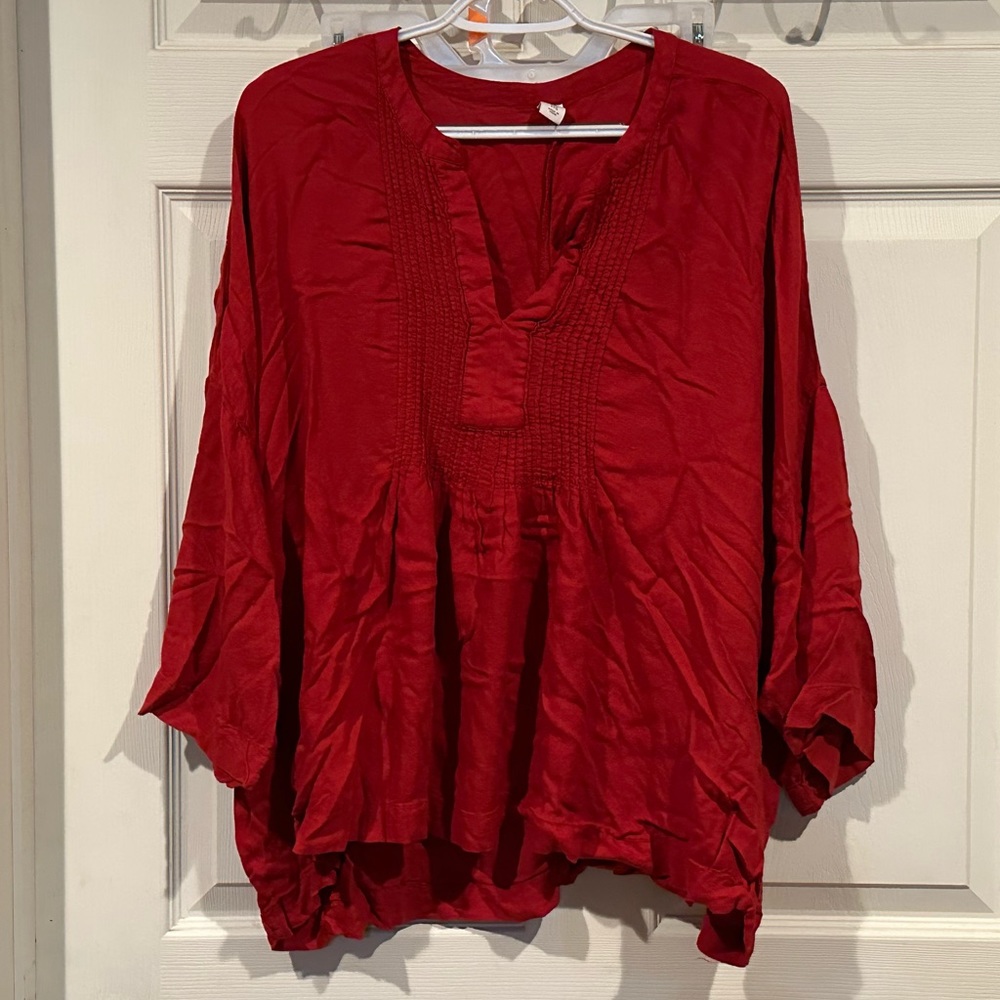 Burnt orange colored blouse